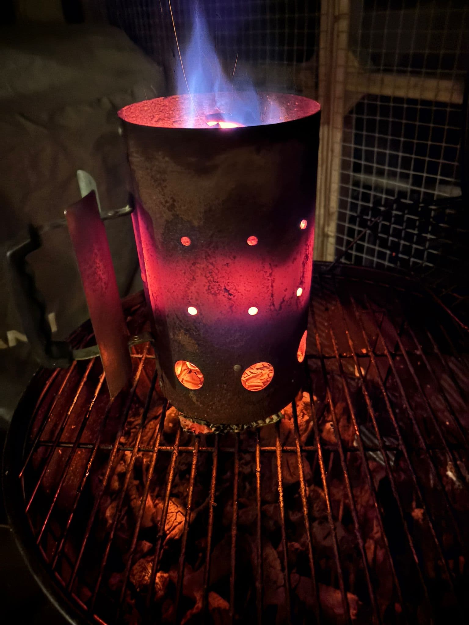 Charcoal chimney glowing at night